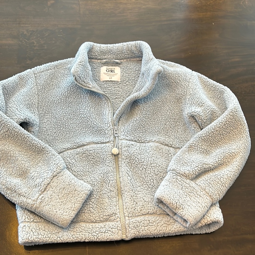Toasty Athleta Girl fleece with zipper front.